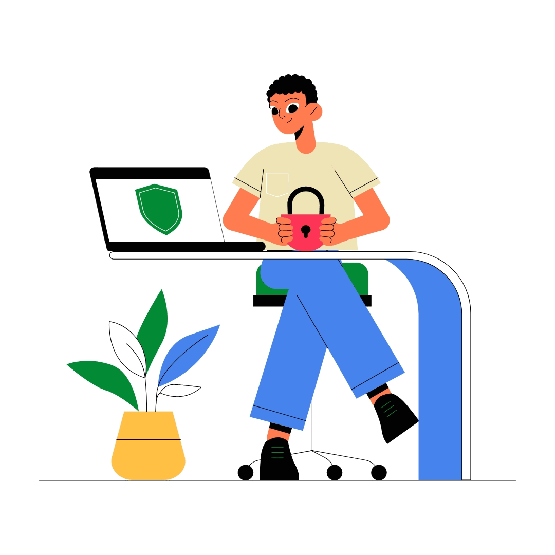 A person sitting at a desk holds a red padlock while looking at a laptop displaying a green shield icon. A potted plant is visible beside the desk.