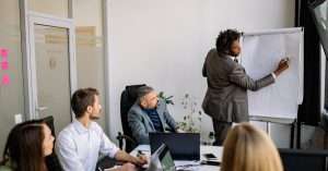 A group of IT professionals discussing server upgrades in an office.
