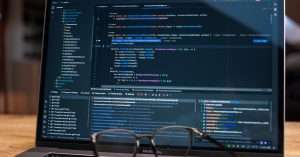 A professional working on software testing automation in an office environment