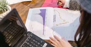 Person studying data analytics on a laptop at home