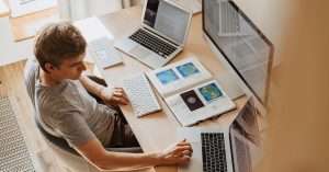Group of students attending an IT training session with laptops