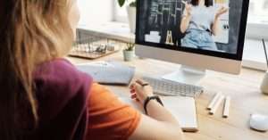 Students attending a virtual IT training session on their laptops