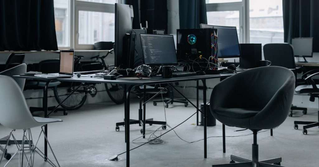 A professional workspace featuring a laptop and cloud computing graphics.