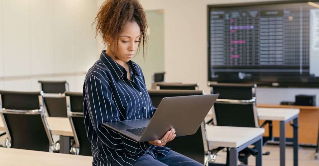 IT professional attending a cloud computing training session on a laptop