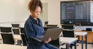IT professional attending a cloud computing training session on a laptop