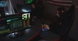 A professional setting with a person studying cybersecurity on a laptop