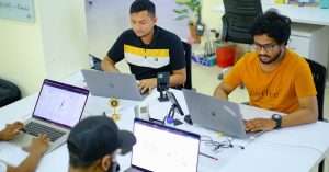 A team collaborating on design tokens using Figma in an office setting