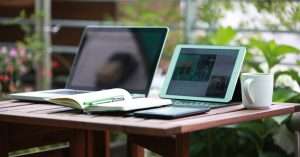 A modern workspace with a laptop and tech training materials