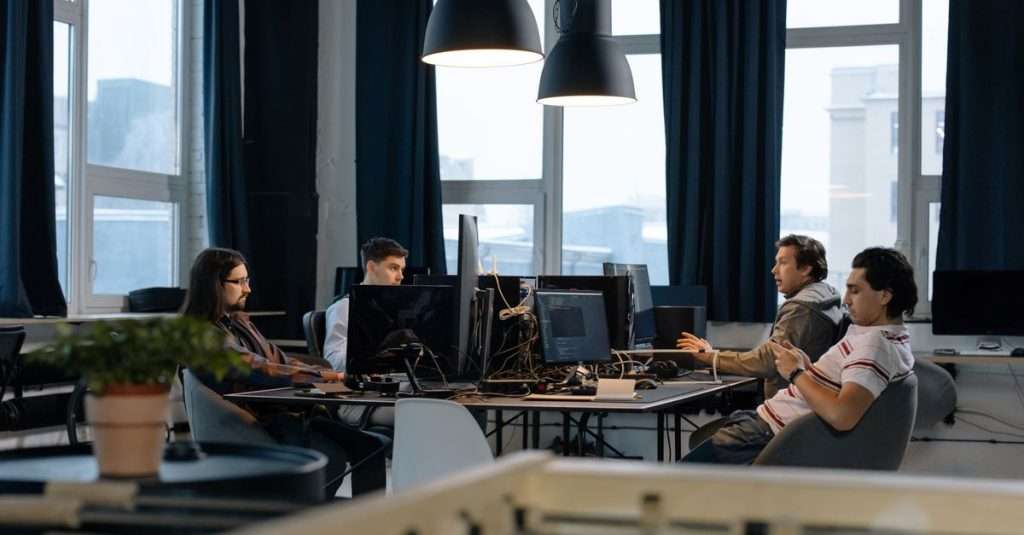 group of software developers collaborating in an office