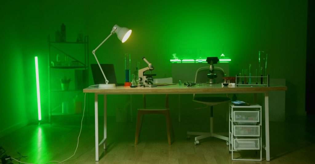 An organized home lab setup for IT support, showcasing a laptop and desktop equipment.