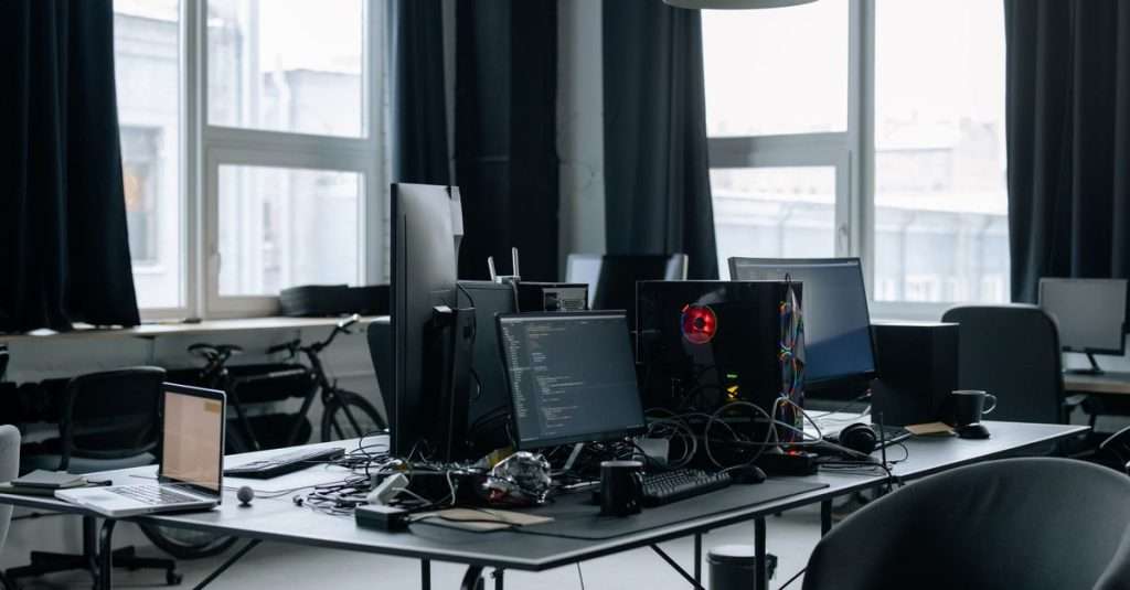 A modern workspace with computers and cloud technology tools.