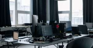 A modern workspace with computers and cloud technology tools.