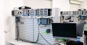 An IT professional configuring servers in a modern office environment