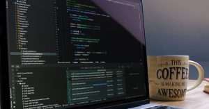 A person working on a laptop in an office setting, showcasing a developer portfolio.