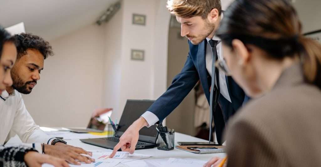Team discussing project plans in a modern office