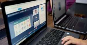 team members engaging in a virtual meeting on laptops